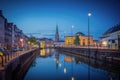 Copenhagen Canal Skyline and Slotsholmen with Nikolaj Kunsthal Tower at night - Copenhagen, Denmark Royalty Free Stock Photo