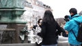 Copenhagen, Denmark Amagertorv square Stork fountain Asian family tourist taking photo fun beautiful Europe trip