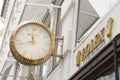 White Rolex clock and Rolex logo