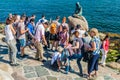 COPENHAGEN, DENMARK - AUGUST 26, 2016: Little Mermaid statue surrounded by a crowd of photographing tourists in