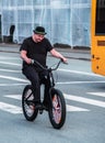 Copenhagen, Denmark Ã¢â¬â August, 17: A man in a hat rides an original bicycle in Copenhagen, Denmark on August 17, 2019 Royalty Free Stock Photo