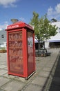 Copenhagen, Denmark - August 22, 2017: Red public booth Public Telephone places in the street Royalty Free Stock Photo