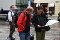 TOURISTS STUDING CITY MAP