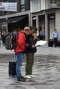 TOURISTS STUDING CITY MAP