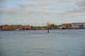 COPENHAGEN, DENMARK: Beautiful panoramic view from the waterfront to the buildings, windmill, boats and the river