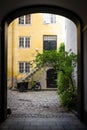 Copenhagen, Denmark: a black Bicycle and a yellow house in a patio in the historical Nyboder district Royalty Free Stock Photo