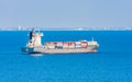 Copenhagen, Denmark. Cargo ships float in blue sea. Marine transport and transportation. Shipping and shipment. Logistics