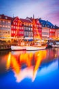 Copenhagen, Denmark. Colorful night water reflection of Nyhavn, Kobenhavn iconic canal Royalty Free Stock Photo