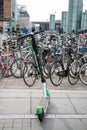 Copenhagen, Denmark - 01 08 2020: Electric Scooter among Parked Bikes on NÃÂ¸rreport Station.