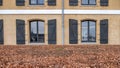 COPENHAGEN, DENMARK Ã¢â¬â The facade of a historic building with large windows and shutters Royalty Free Stock Photo