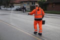 COUNCIL WORKER SPREADING DUE TO SLIPPER ROAD