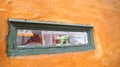 COPENHAGEN, DENMARK - JUL 06th, 2015: Detail of a wooden window at Nyboders Mindestuer Museum - yellow historical