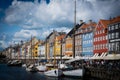 Copenhagen, Denmark - July, 2019: Copenhagen iconic view. Famous old Nyhavn port with colorful medieval ho