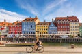 Copenhagen, Denmark - July, 2019: Copenhagen iconic view. Famous old Nyhavn port with colorful medieval houses, tourist ship and