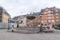 Oldest fountain in Copenhagen with tourist. The Caritas Well Danish: Caritasbronden. Royalty Free Stock Photo