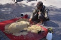 GYSPY MALE CREATING SAND dog SCULPTURE