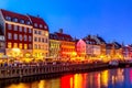 Copenhagen, Denmark - July, 2019: View of the old Nyhavn canal of Copenhagen in the evening sunset Royalty Free Stock Photo