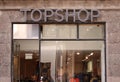 Topshop logo on panel at store. Topshop is a British fashion retailer with more than 500 shops worldwide. Royalty Free Stock Photo