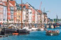 Beautiful view with colorful facade of traditional houses and old wooden ships along the Nyhavn Canal, Copenhagen, Denmark Royalty Free Stock Photo