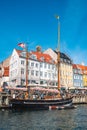 Beautiful view with colorful facade of traditional houses and old wooden ships along the Nyhavn Canal, Copenhagen, Denmark Royalty Free Stock Photo