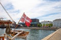 Danish flag on the mast of the yacht in Copenhagen. Royalty Free Stock Photo