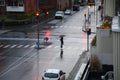 Person walks under umbreaa in rain weather in Copenhagen Royalty Free Stock Photo