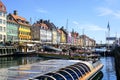 Copenhagen, Denmark- May 30, 2023: Several boats full of tourists maneuver in Nyhavn harbor canal Royalty Free Stock Photo