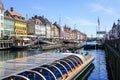 Copenhagen, Denmark- May 30, 2023: Several boats full of tourists maneuver in Nyhavn harbor canal Royalty Free Stock Photo