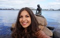 COPENHAGEN, DENMARK - MAY 31, 2017: tourist girl taking selfie photo with the bronze statue of the Little Mermaid Royalty Free Stock Photo