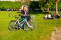 Two girls with bikes at the King`s garden next to Rosenborg castle Royalty Free Stock Photo