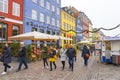 Colourful facades on Nyhavn embankment with many tourists sightseeing in Copenhagen, Denmark
