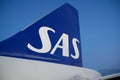 COPENHAGEN, DENMARK - NOV 24, 2018: View of the blue SAS Scandinavian Airlines logo on the tail unit of the Airbus A320