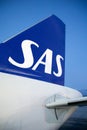 COPENHAGEN, DENMARK - NOV 24, 2018: View of the blue SAS Scandinavian Airlines logo on the tail unit of the Airbus A320