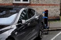 AMERICAN TESLA ELECTRIC AT CHARGE POINT IN KASTUP