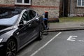 AMERICAN TESLA ELECTRIC AT CHARGE POINT IN KASTUP
