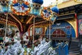 Copenhagen / Denmark - November 2019: Empty carousel in Tivoli Gardens during Christmas time. Decorated park for tourists. Famous