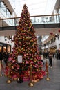 VISITORS INSPECT CHRISTMAS TREE AND DEORAATIONS