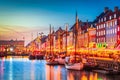 Copenhagen, Denmark. Nyhavn, Kobenhavn\'s iconic canal, colorful evening water reflection