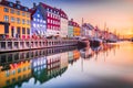 Copenhagen, Denmark. Nyhavn, Kobenhavn\'s iconic canal, colorful sunrise water reflection Royalty Free Stock Photo