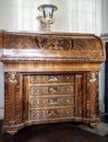 Ornate wooden antique cabinet with patterns and golden inlays