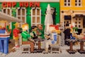 Funny figures having dinner, Lego construction toys inside popular store for kids and collectors