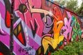 Long wall covered by colorful graffiti, Christiania, Copenhagen, Denmark Royalty Free Stock Photo