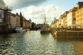 Copenhagen. Denmark. 12 September. 2021. Nyhavn. People are resting on the banks of the canal with ships. Sunny day. Historical