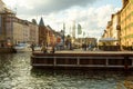 Copenhagen. Denmark. 12. September. 2021. Nyhavn. People are resting on the banks of the canal with ships. Sunny day. Historical