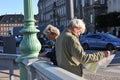 Senior tourists studing Copenhagen city may on Hojbriobridge