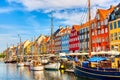 Copenhagen iconic view. Famous old Nyhavn port in the center of Copenhagen, Denmark during summer sunny day