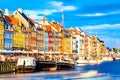 Copenhagen iconic view. Famous old Nyhavn port in the center of Copenhagen, Denmark during summer sunny day Royalty Free Stock Photo