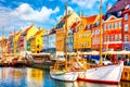 Copenhagen iconic view. Famous old Nyhavn port in the center of Copenhagen, Denmark during summer sunny day Royalty Free Stock Photo