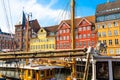 Copenhagen iconic view. Famous old Nyhavn port with colorful medieval houses in the center of Copenhagen, Denmark during summer Royalty Free Stock Photo