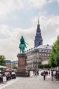 Copenhagen, Denmark. Looking from Hojbro Plads square with statue of warrier bishop Absalon to Christianborg Palace